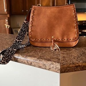 stormi Dreams crossbody saddle bag the back has a zipper nwt